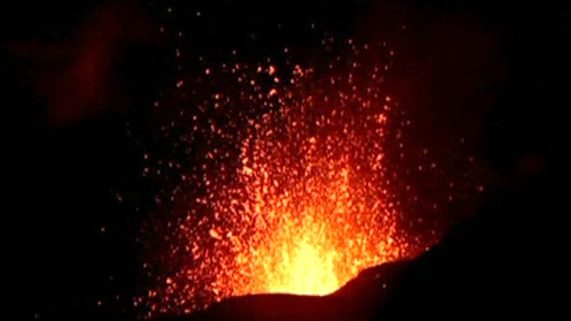 Molten lava spews from erupting volcano in Russia 