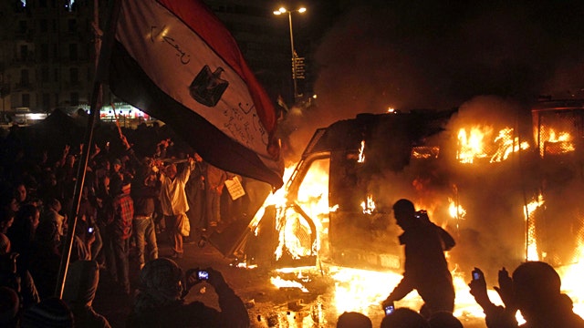 Riots rage across Egypt as Morsi declares state of emergency
