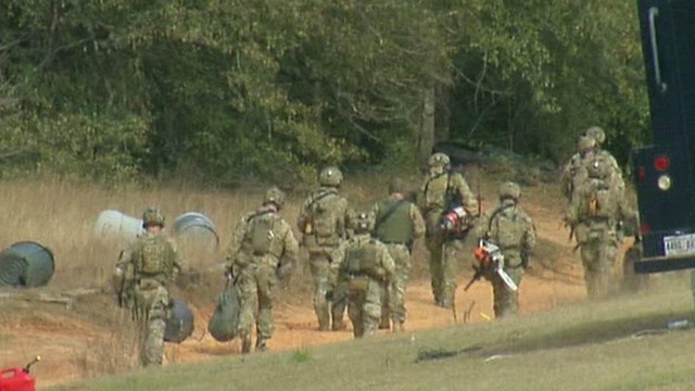 Hostage negotiators work to free boy held in bunker