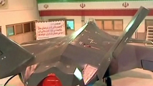 Iran unveils new stealthy fighter jet