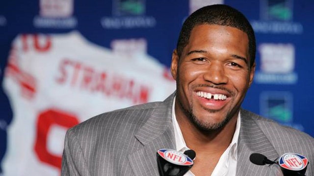 Michael Strahan still suffers racial taunts