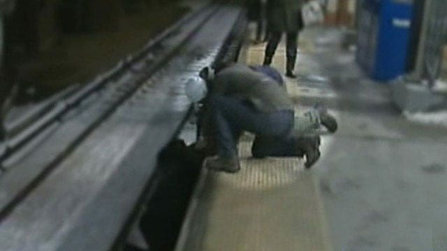 Fox reporter, bystanders save man who fell on tracks