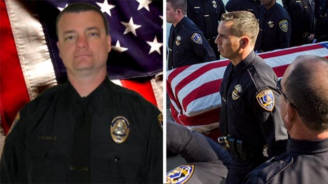 Honor guard lays slain officer to rest in Riverside, CA