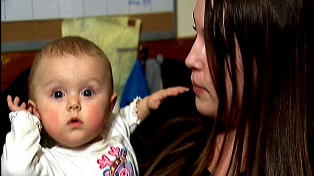 Baby and mother robbed at knifepoint