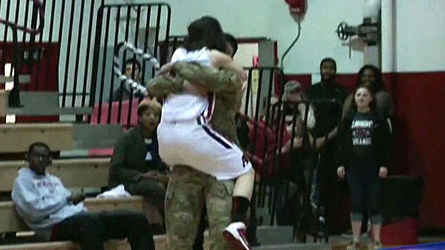 Basketball star surprised on court by military brother