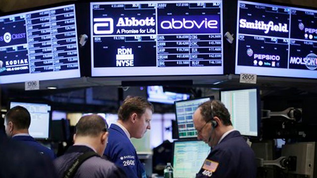 Dow fluctuates after hitting all-time high last week