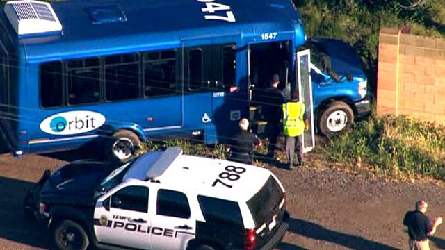 Stolen bus crashes through neighborhood