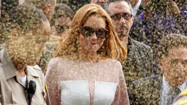 'Glitter-bomb' greeting for Lindsay Lohan at court arrival
