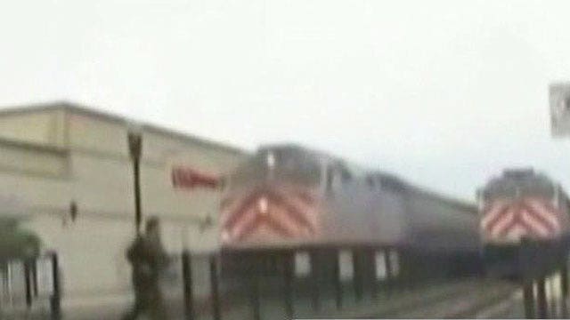 Watch as speeding train nearly hits man crossing tracks