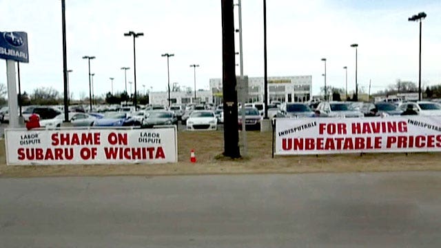 Car dealership fights union's bullying tactics