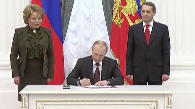 Putin signs bill completing annexation of Crimea