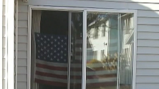 Grandma wins fight to keep American flag in window