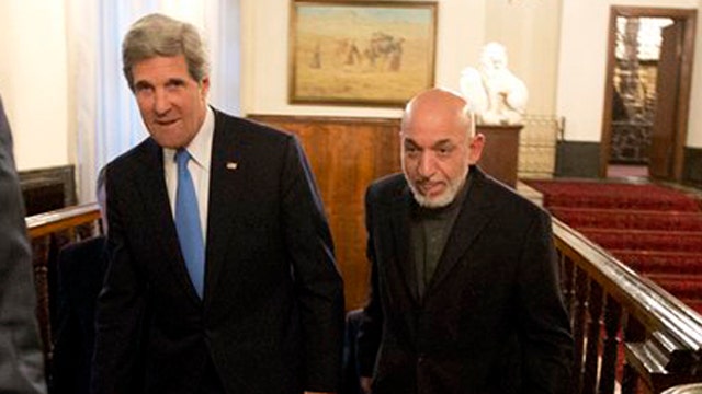 Karzai accuses US of atrocities - to John Kerry's face