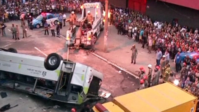 Around the World: Bus plunges off overpass onto busy street