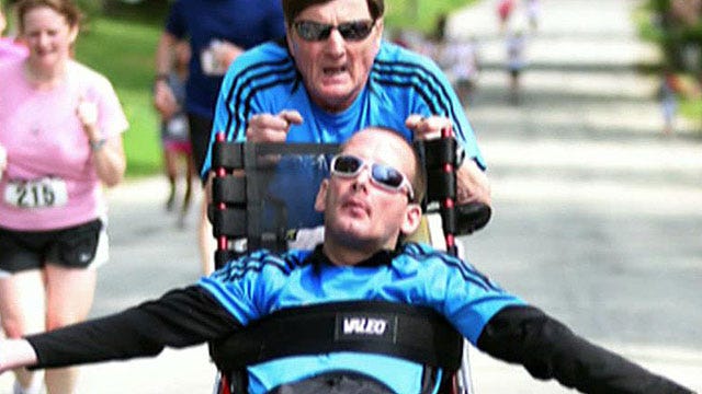 Father runs marathons with wheelchair-bound son
