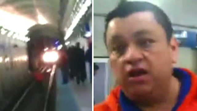 Hero jumps on tracks to save woman from oncoming subway