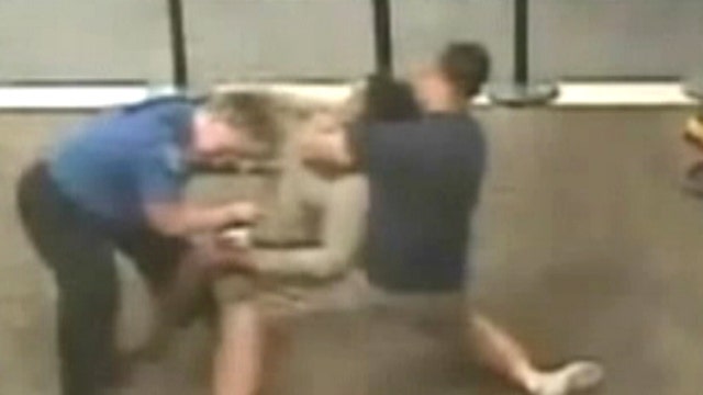 Airport takedown: Off-duty cop subdues unruly woman