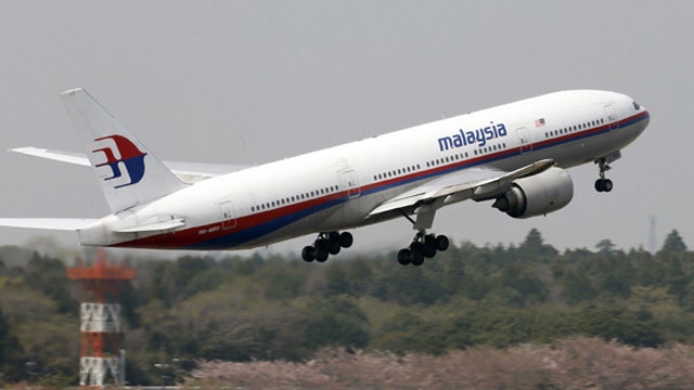 Probe for Malaysia Airlines jet a 'race against time'