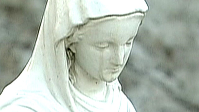Believers flock to see 'crying' Virgin Mary statue