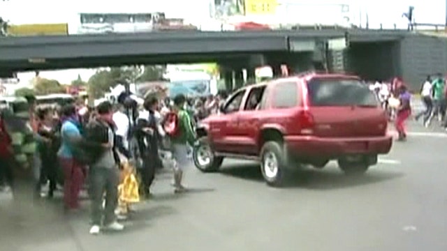 SUV plows through student protest in Mexico