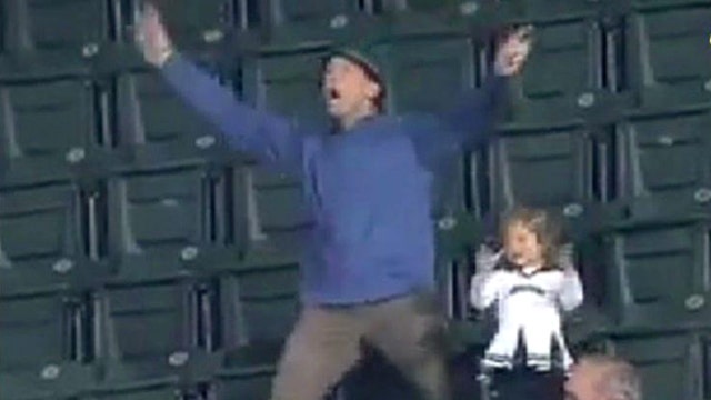 Dad busts a move at baseball game