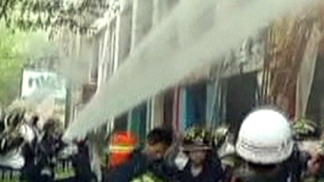 Around the World: Fire rips through packed hotel in China