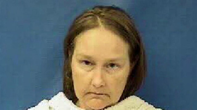 Wife of former Texas justice arrested in DA killings