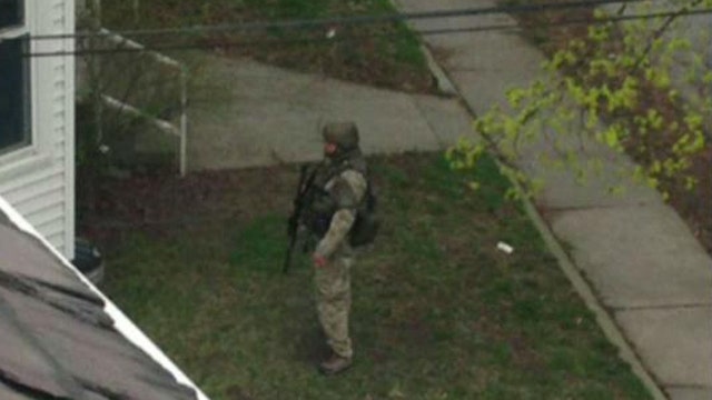 Boston suburbs on lockdown as manhunt continues