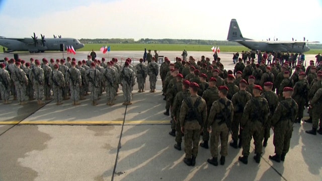 US sends message to Putin as troops arrive in Poland