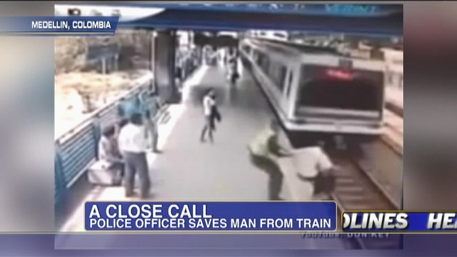 Police Officer Saves Man From Train 