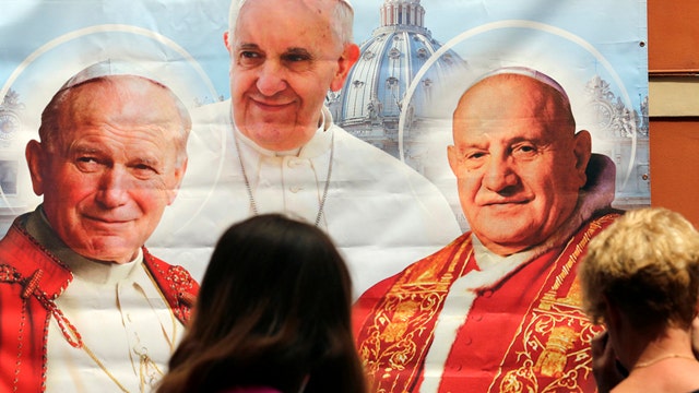 What makes Popes John XXIII and John Paul II saints?