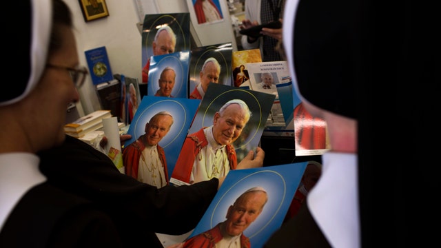 Will dual canonizations reconcile Catholic Church?