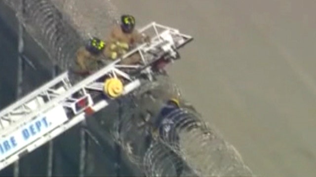 Caught in the act: Man stuck in barbed wire on border fence