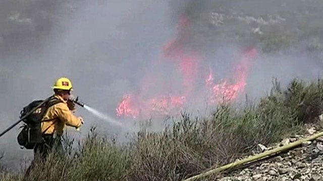 Firefighters battle wildfire in foothills near LA