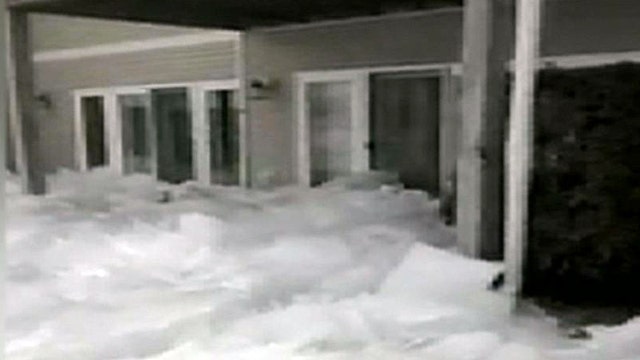 Frozen lake moves towards homes