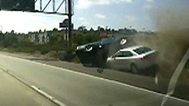 Pickup flips in possible road rage collision caught on tape