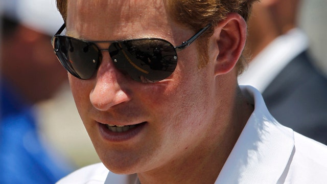 Prince Harry visits towns hit hard by Superstorm Sandy
