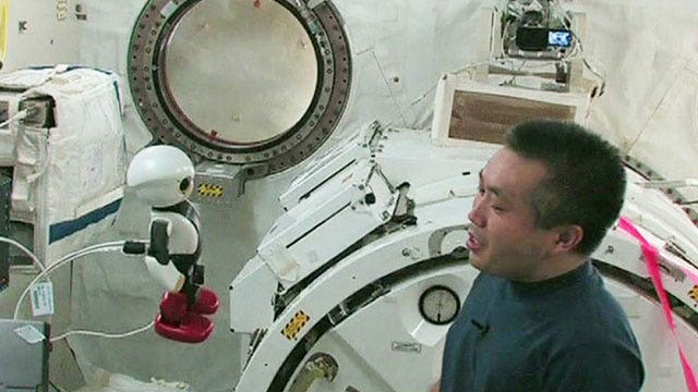 Astronaut says goodbye to cute talking robot companion