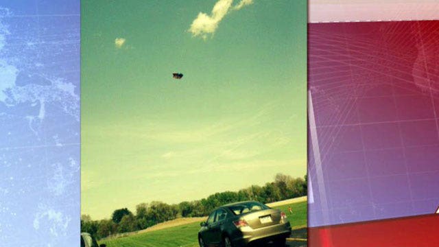 Bounce house blows away, seriously injuring two