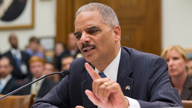 Holder lashes out during tense hearing on WH scandals
