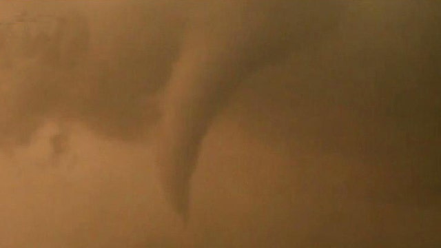 Storm chaser heads towards tornado warning