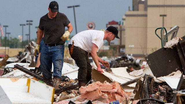 Devastated community holds out hope in search for survivors