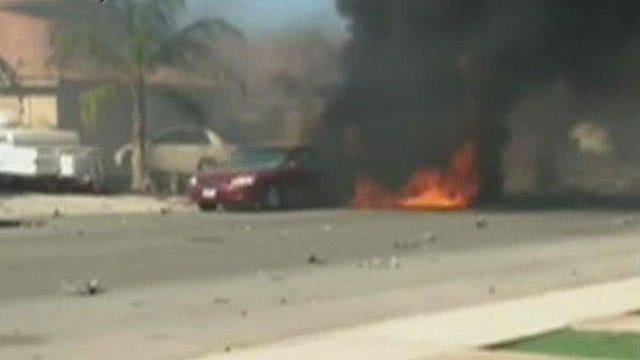 Military jet crashes into residential neighborhood