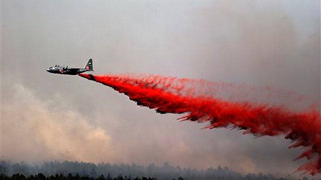 Fast-moving Colo. wildfires consume homes