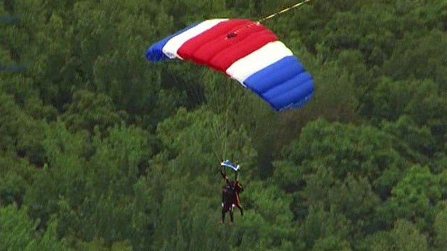 George H.W. Bush marks 90th birthday with parachute jump
