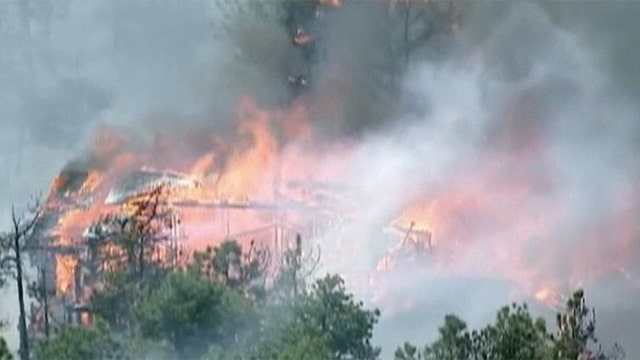 Wildfires rage across Colorado