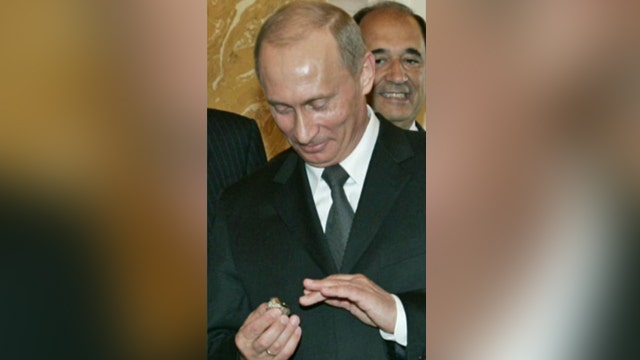 Putin takes off with Super Bowl ring