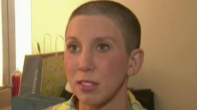 Woman resigns after shaving head for cancer-stricken sister