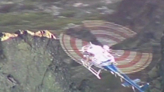 Rescuers use helicopter to save trapped hikers