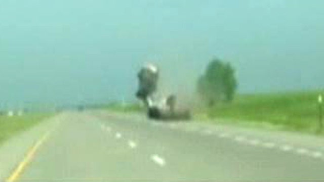 Jeep goes airborne, flips after smashing into trailer